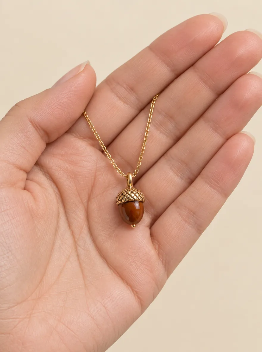 Acorn Cap Pendant — In the hand, for scale