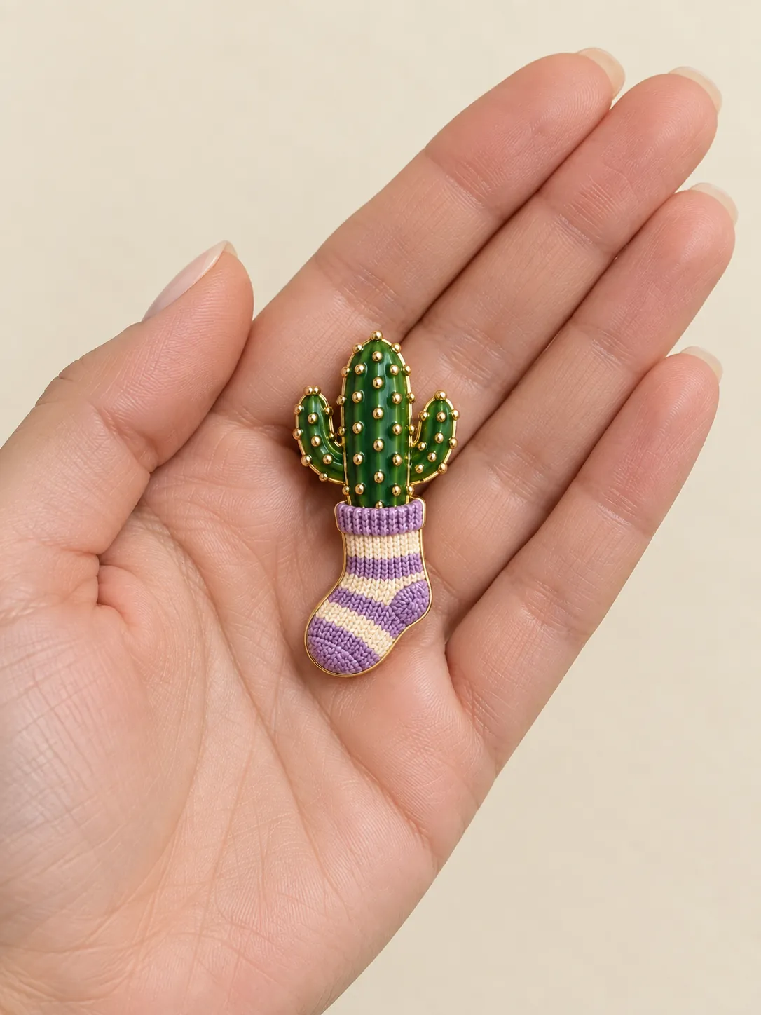 Cactus in a Sock Brooch — In the hand, for scale