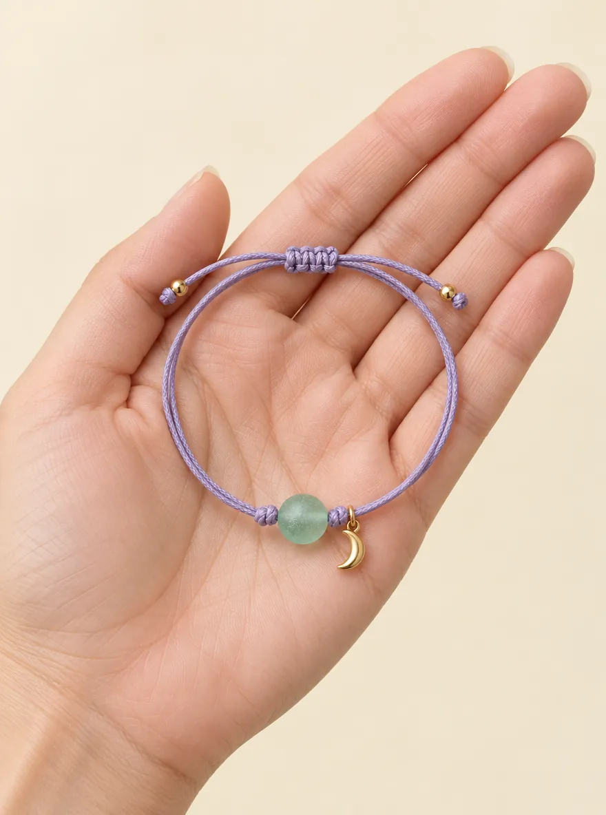 Frosted Glass Cord Bracelet — In the hand, for scale