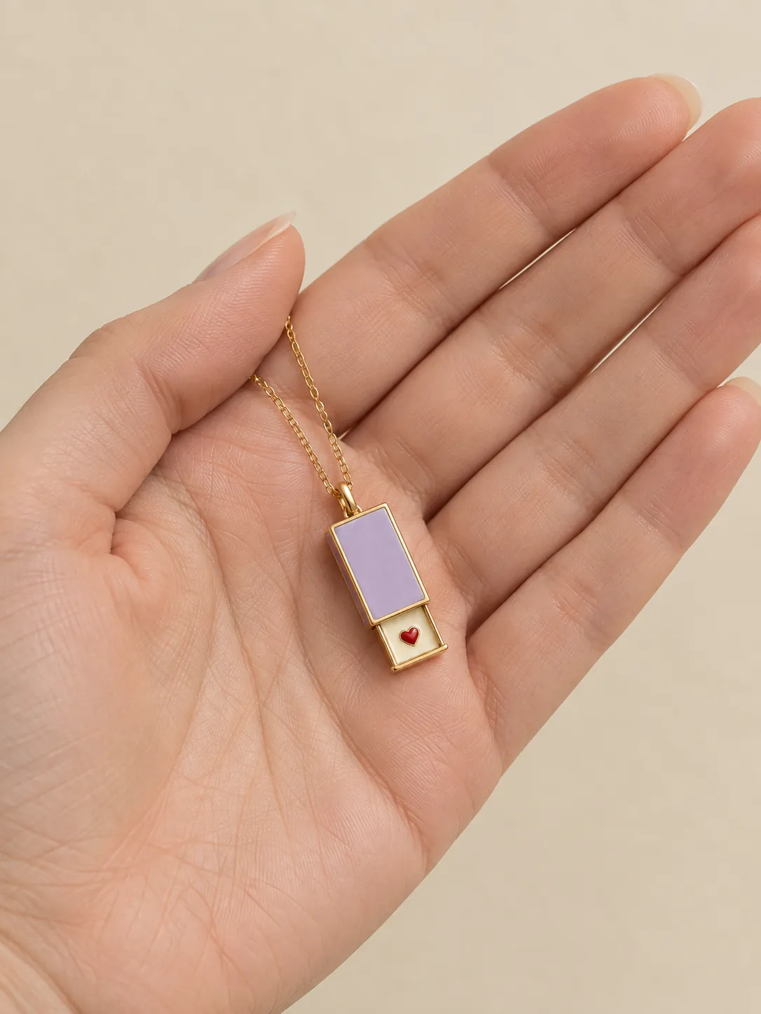 Matchbox Keepsake Pendant — In the hand, for scale