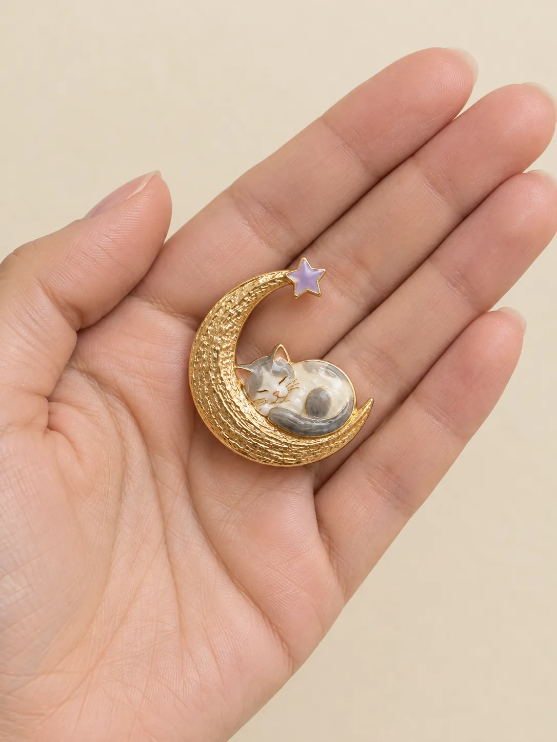 Moon Nap Brooch — In the hand, for scale