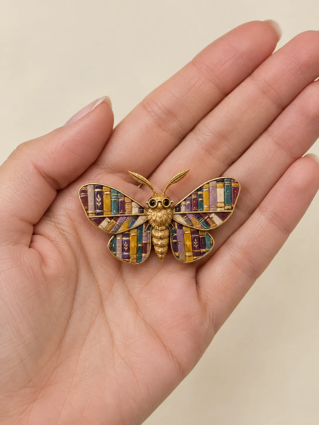 Moth Librarian Brooch — In the hand, for scale