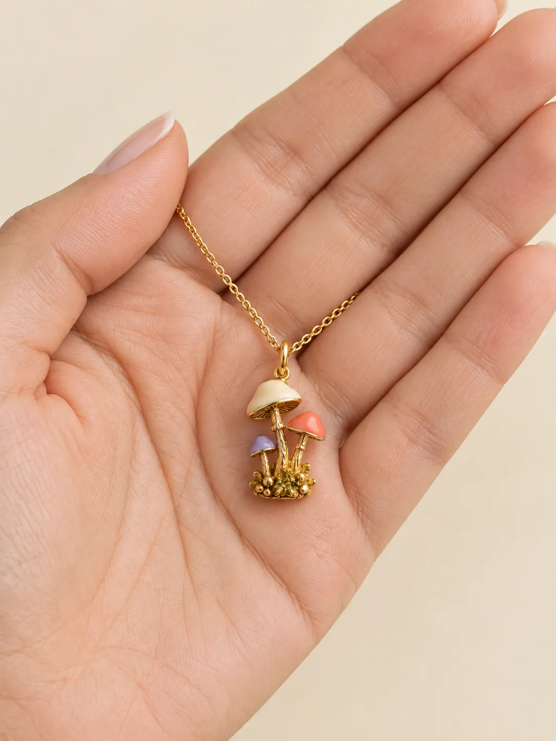 Mushroom Cluster Pendant — In the hand, for scale