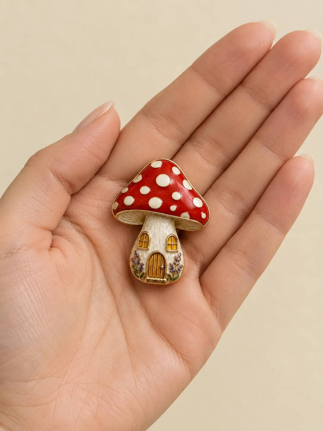 Mushroom Lantern Brooch — In the hand, for scale