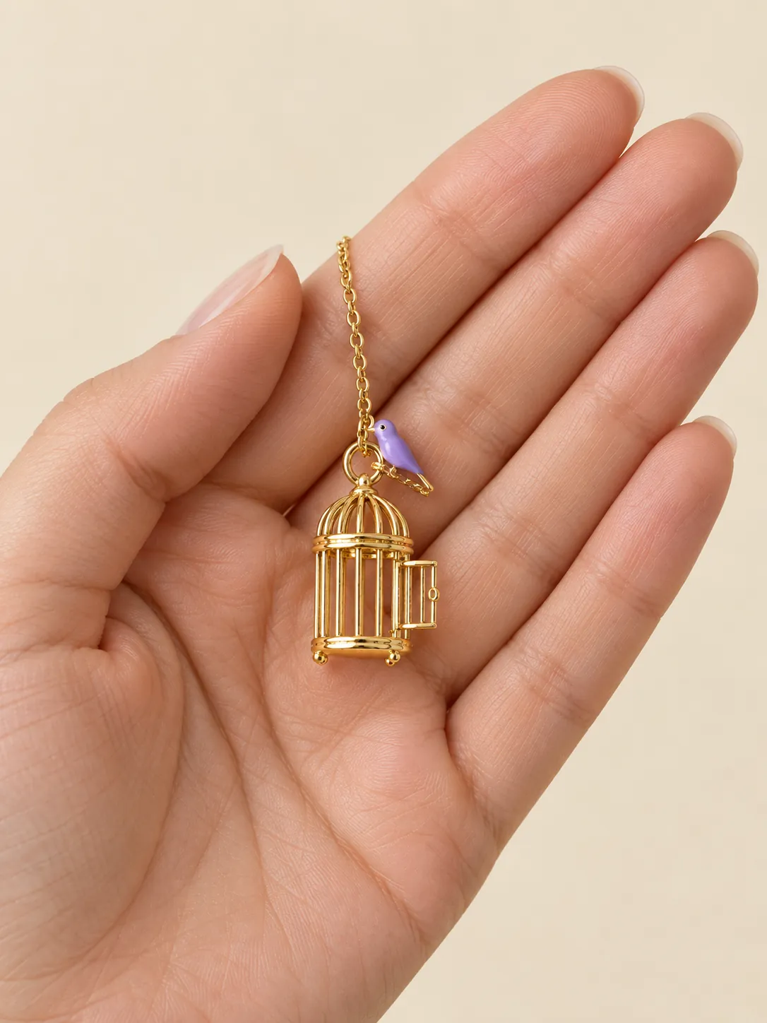 Open Cage Pendant — In the hand, for scale