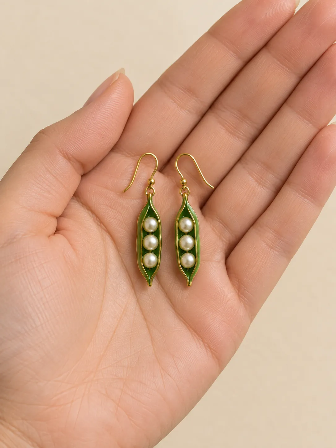 Pea Pod Drops — In the hand, for scale