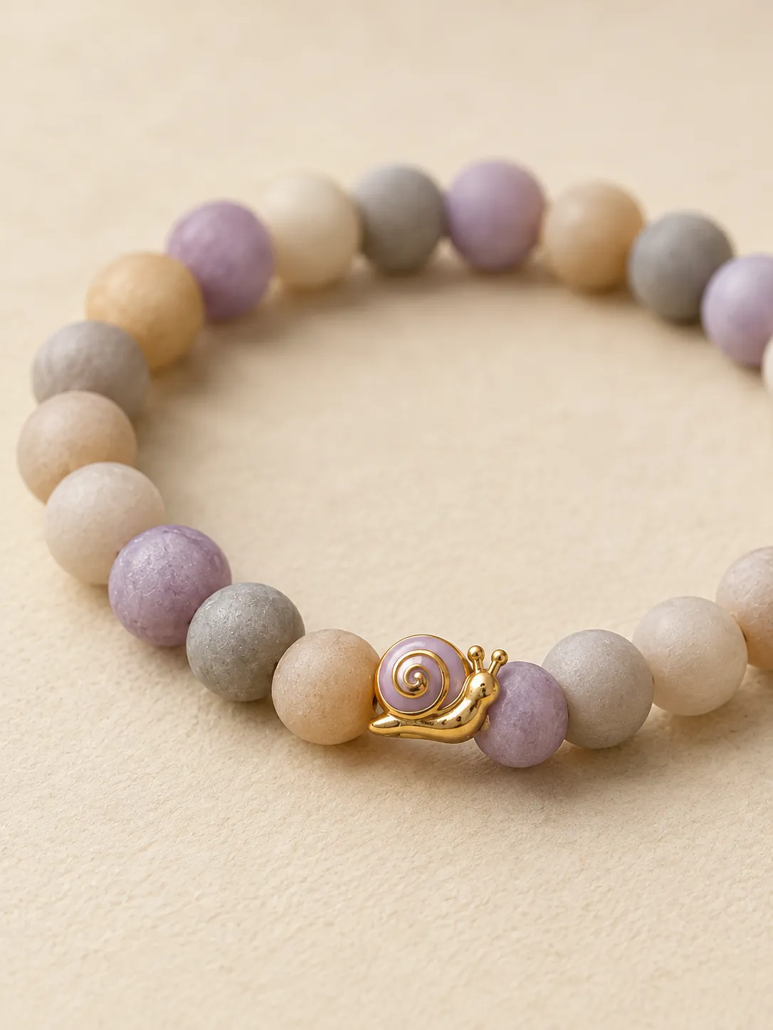 Pebble & Snail Beaded Bracelet — Close-up detail