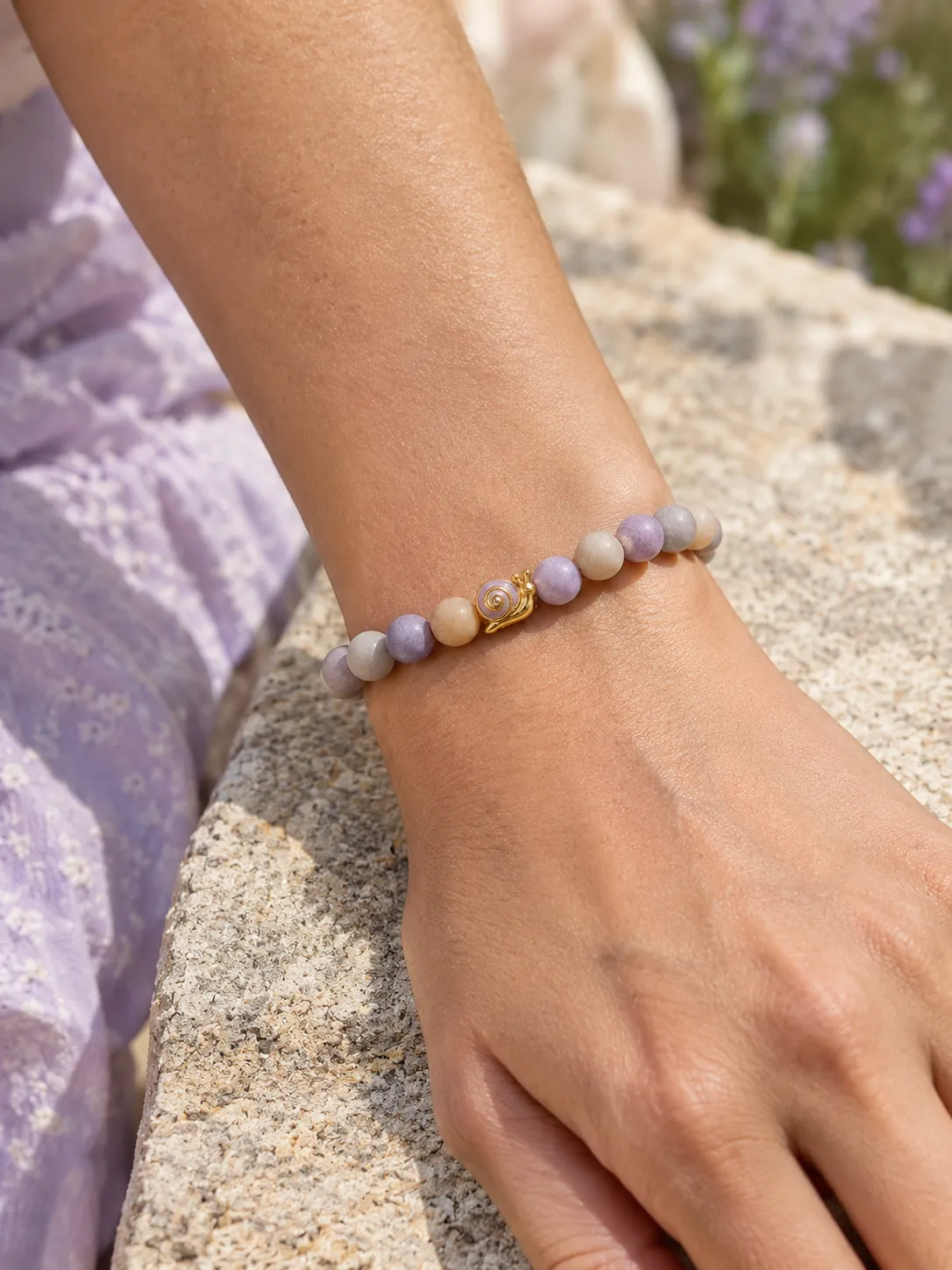 Pebble & Snail Beaded Bracelet — Main view, worn