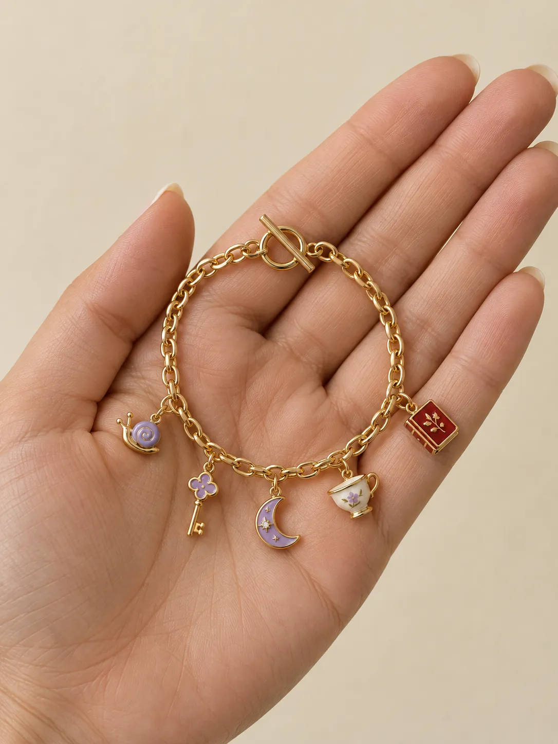 Pocket Museum Charm Bracelet — In the hand, for scale