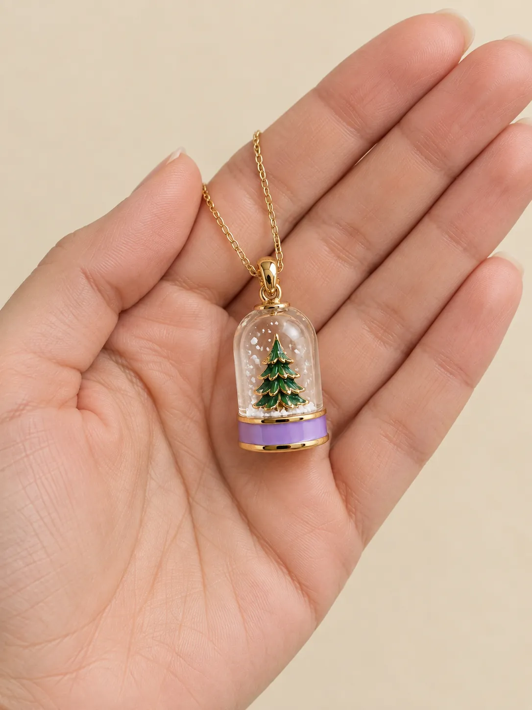 Pocket Snow Globe Pendant — In the hand, for scale