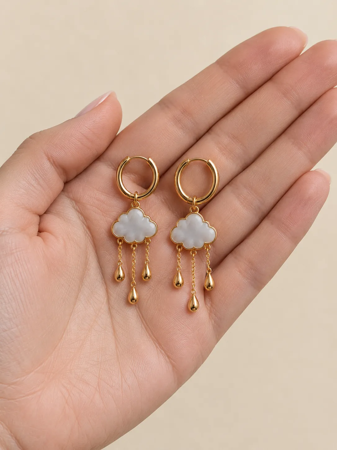 Rain Cloud Hoops — In the hand, for scale