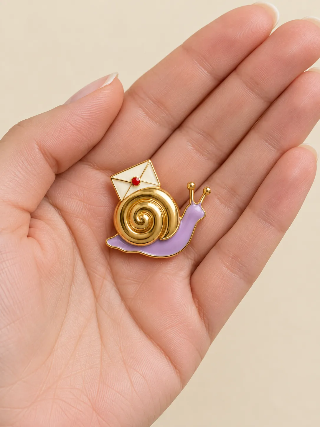 Snail Post Brooch — In the hand, for scale