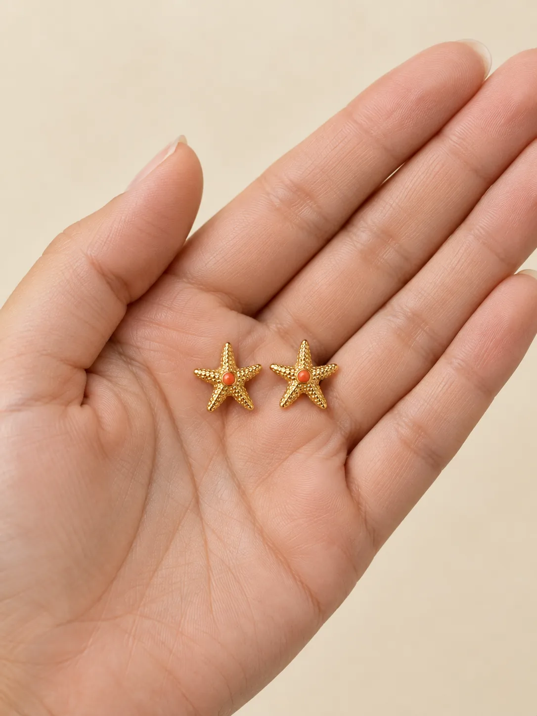 Starfish Studs — In the hand, for scale