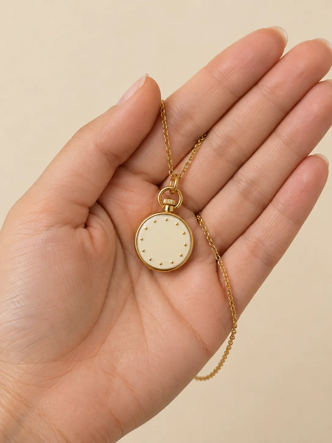 Time Off Pocket Watch Pendant — In the hand, for scale