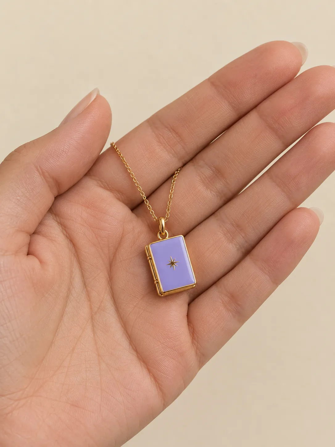 Tiny Book Pendant — In the hand, for scale