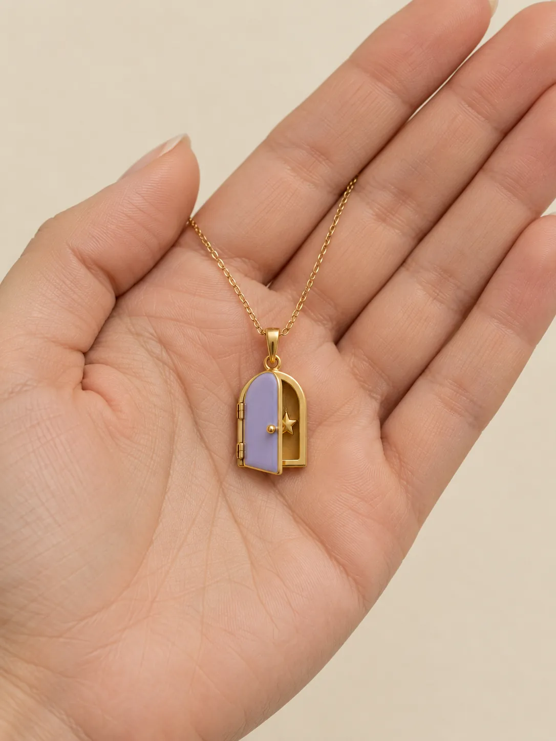 Tiny Door Locket — In the hand, for scale